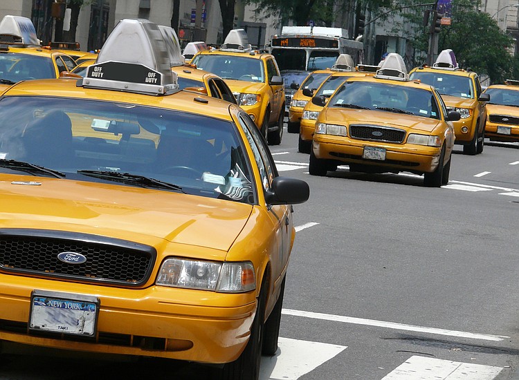 New York taxi drivers call for pay guarantee, limits on cars for hire