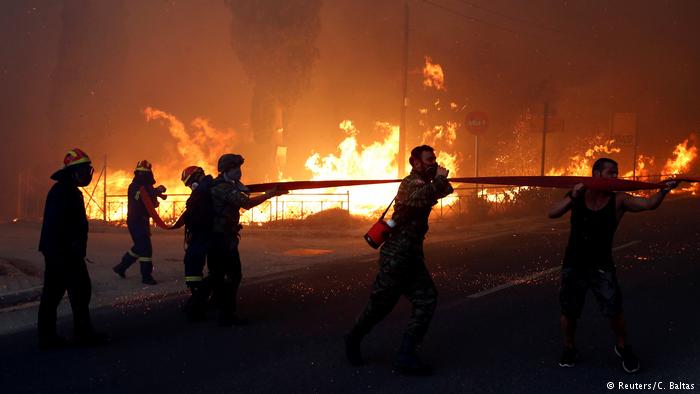 Wildfire kills at least 50 near Athens, flames trap families as they flee