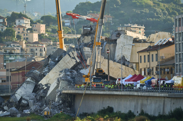 Rescuers deal with fire in Italian bridge rubble before day of mourning