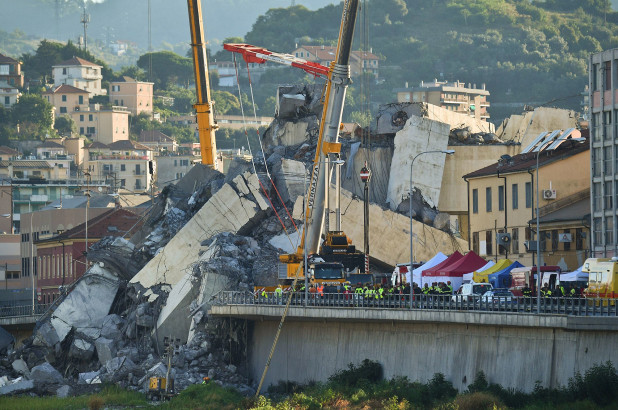 Rescuers deal with fire in Italian bridge rubble before day of mourning