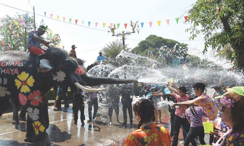 As drought bites, Thailand cities urged to rein in festive water fights