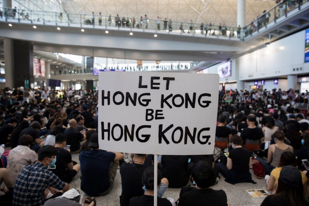 Hong Kong protesters target airport but planes keep flying