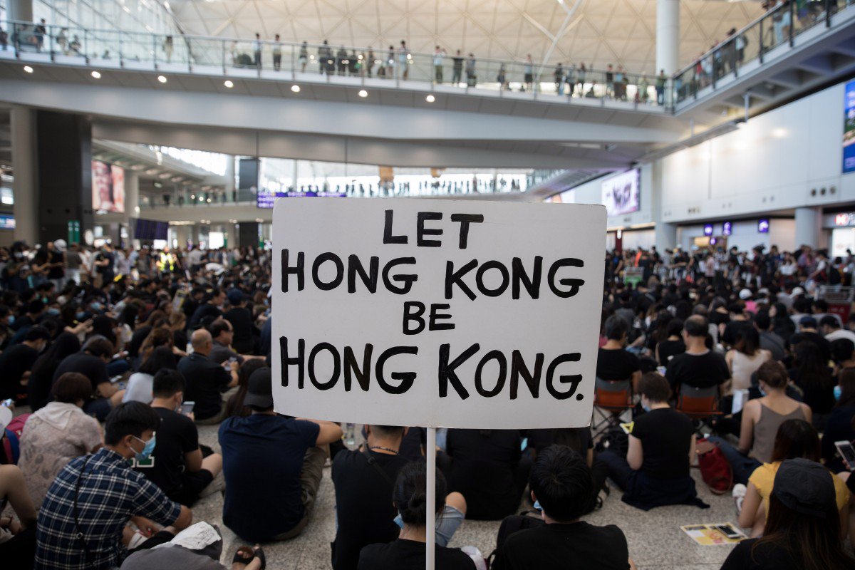 Hong Kong protesters target airport but planes keep flying